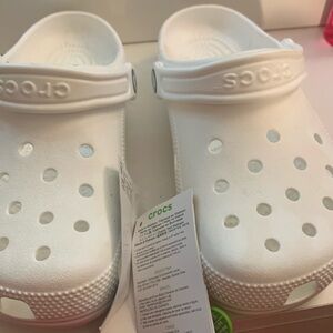 The brand is croc size 6, and they are white
